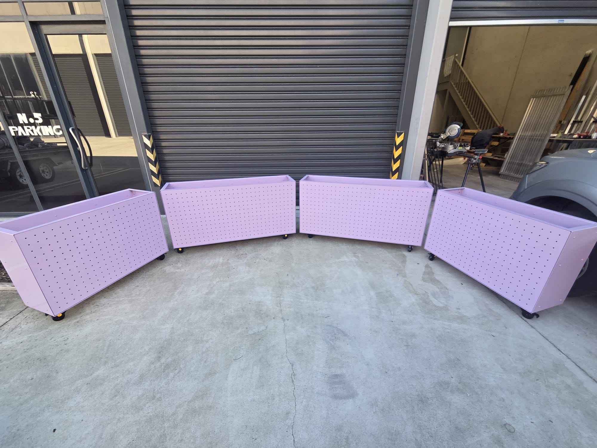 Curved perforated steel planter boxes fabricated by True-Line Installs